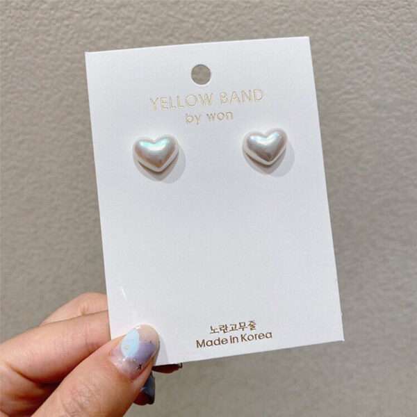aretes corazones blancos