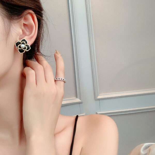 aretes flores ch negras - Imagen 2