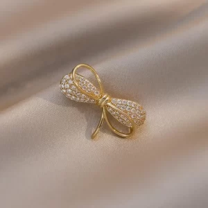 broche bow zircon