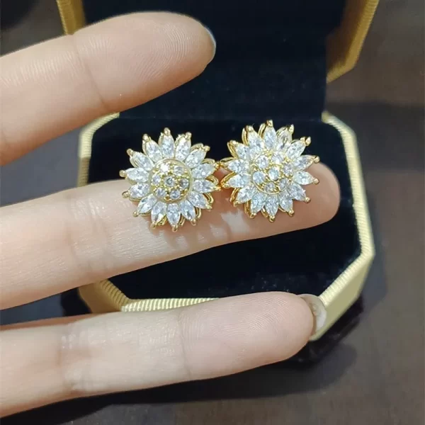 aretes girasol rotable Golden