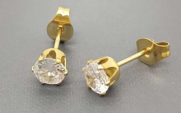 aretes zircon steel dorados