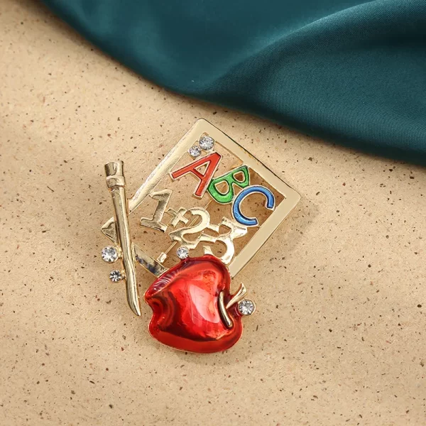 broche profesora ABC