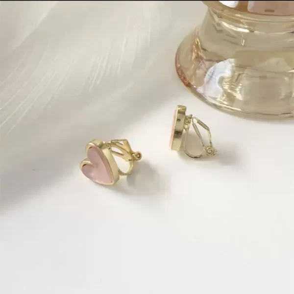 aretes broche de clip corazon madre perla pink