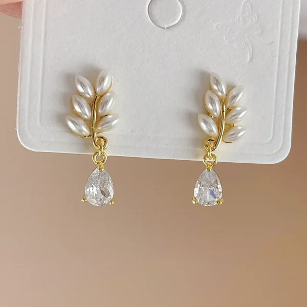 aretes hojitas trigo perla zircon