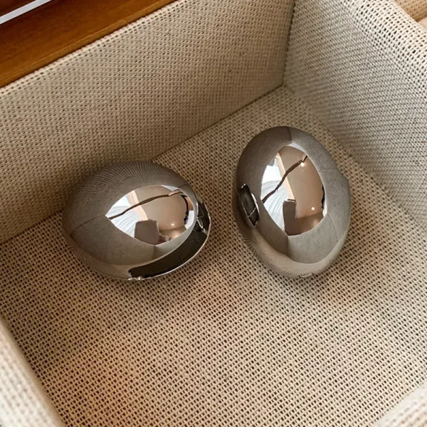 aretes ovalos shell steel plateados