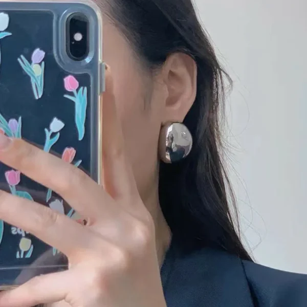aretes ovalos shell steel plateados - Imagen 2