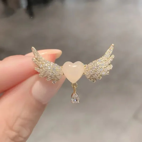 Broche alitas corazon zircon