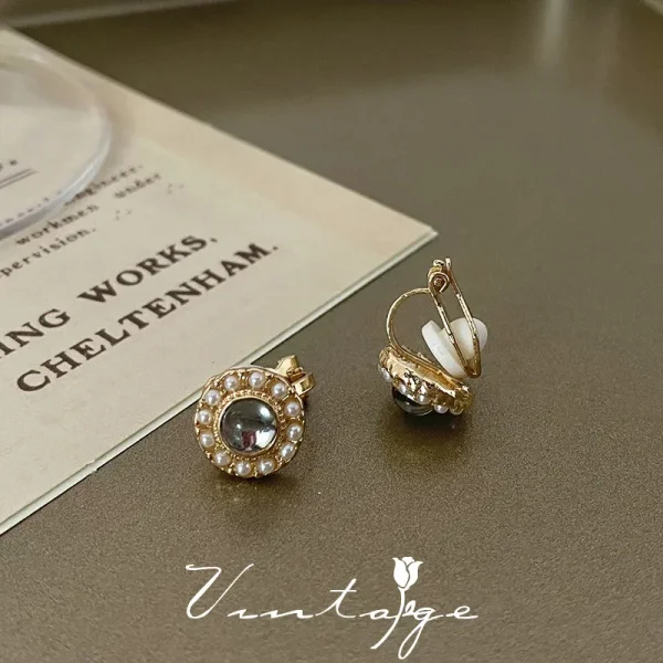 aretes broche de clip perla grises