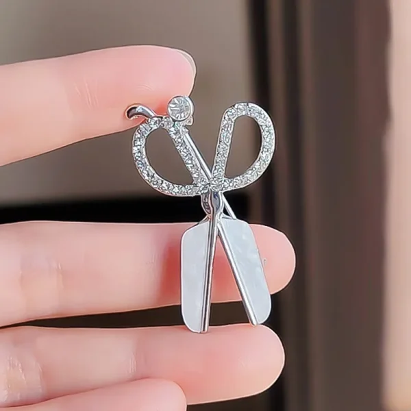 Broche tijeras